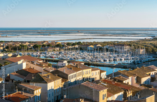 Marina of Gruissan town, Grazel Pond ant Mediterranean coastline as seen from Barberousse Tower. Occitanie, France.