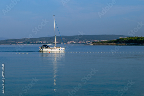   Panoramic  view  sea morning . Sailing boat against a blue sky. Quiet and calm morning. Concept of summer adventures, holidays, active summer holidays .