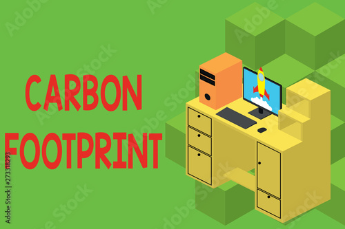 Text sign showing Carbon Footprint. Business photo showcasing amount of dioxide released atmosphere result of activities Working desktop station drawers personal computer launching rocket clouds