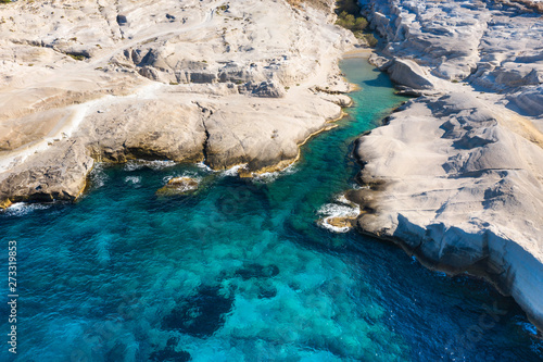 aerial view to emerald bay on rock beach on the greek island Milos
