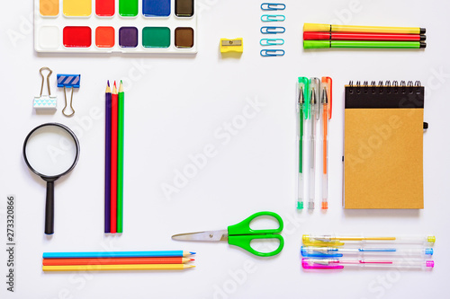 Frame with school supplies on a white background. Flat lay, top view. Back to school concept