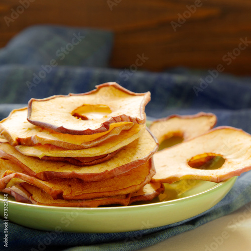  Apple chips on plate. Healthy natural food, clean eating concept.