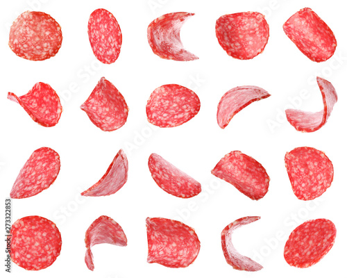 Tableau sur toile Set of flying cut fresh sausage on white background