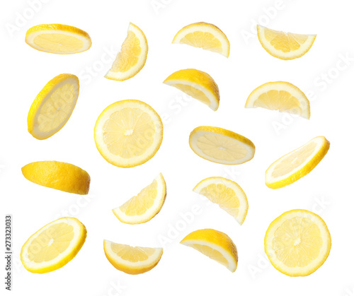 Tela Set of flying cut fresh juicy lemon on white background