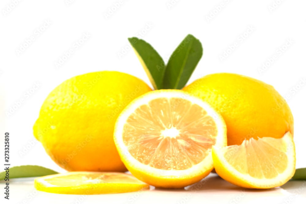 fresh lemon with lime and leaves on white background