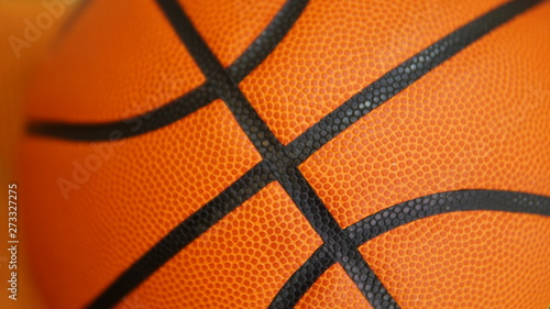 Closeup detail of basketball ball texture background © www.akolosov.art 