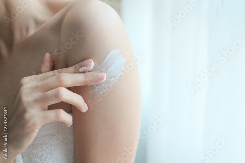 Woman applying arm cream,lotion , Hygiene skin body care concept.