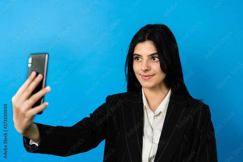 bussiness woman look at smartphone, make selfie and smile. Happy woman bussiness woman look at smartphone, make selfie and smile. Happy woman