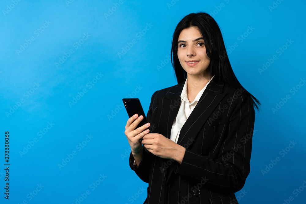 bussiness woman with smartphone, look at camera, smile. Happy young woman bussiness woman with smartphone, look at camera, smile. Happy young woman