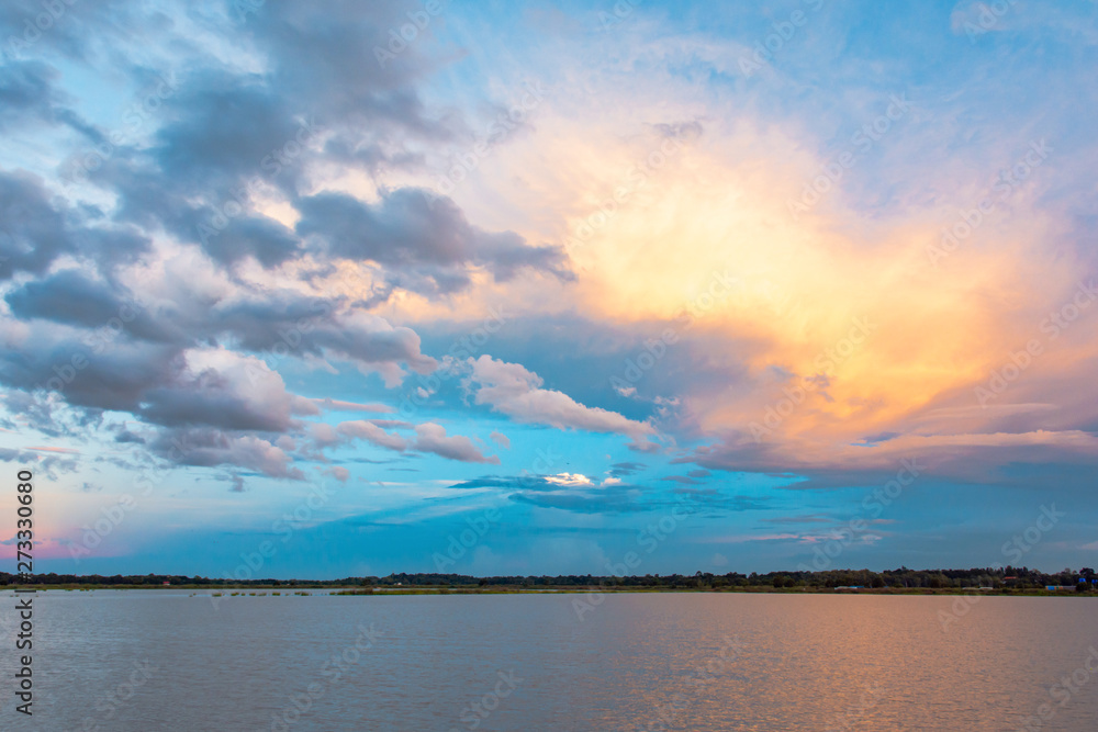Sky and cloud at sunset with sunset light effects background. clouds twilight and dramatic sky background. Sky and cloud at sunset with sunset light effects background. clouds twilight and dramatic sky background.