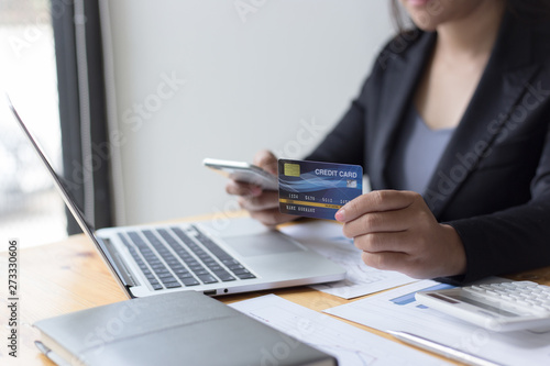 Young women are buying products online via the internet and making payments via credit cards online.