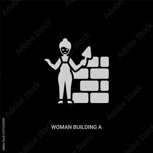 white woman building a wall vector icon on black background. modern flat woman building a wall from ladies concept vector sign symbol can be use for web, mobile and logo.