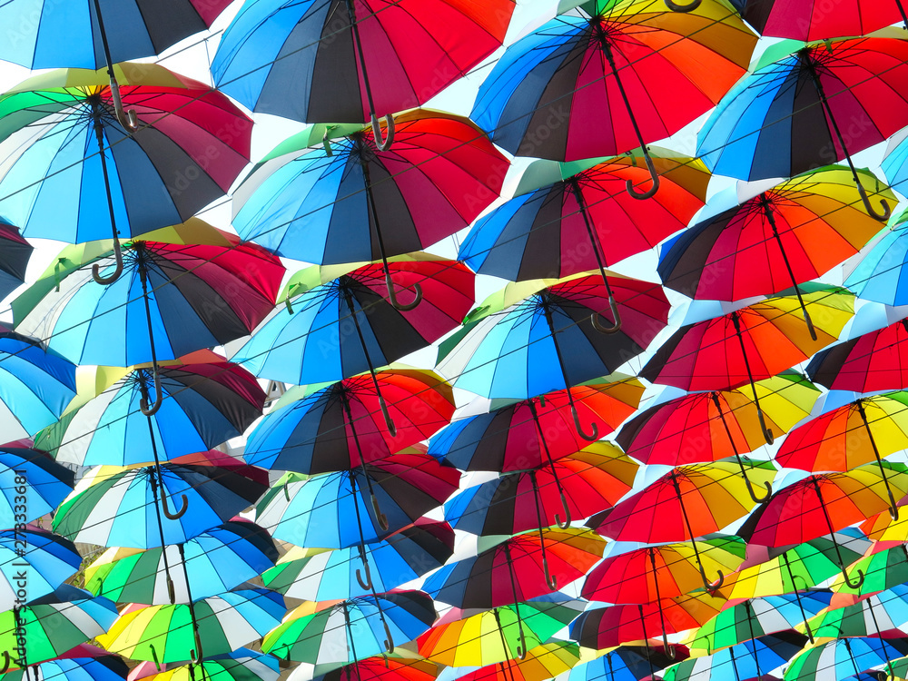 many colored umbrellas in the sky. Multicolored background. Umbrella. Weather       