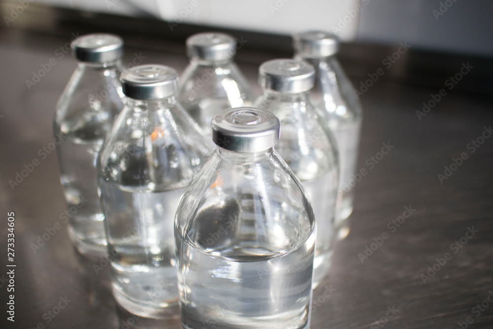 bottles with solutions on the medical table bottles with solutions on the medical table