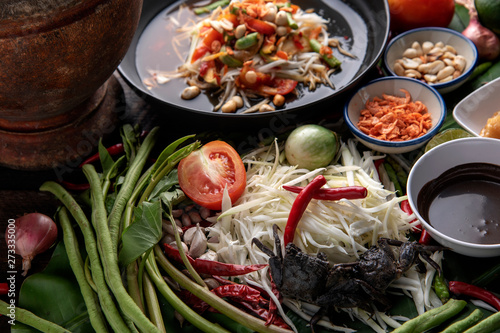 Som Tam Thai - Papaya Salad Thai Food Style on wooden tabal background. Thai Food Concept.