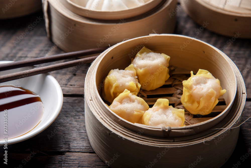 Dim sum on wooden table. Chinese food concept. Dim sum on wooden table. Chinese food concept.