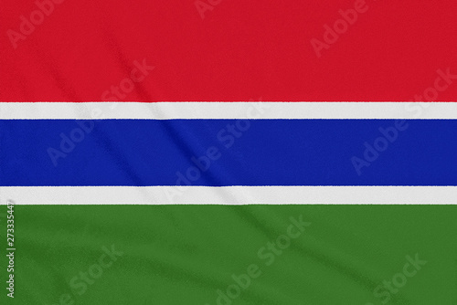 Flag of Gambia on textured fabric. Patriotic symbol © somemeans
