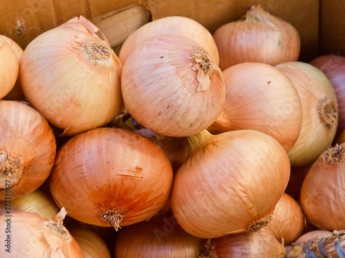 Pile of whole fresh onions on a food market in Portugal