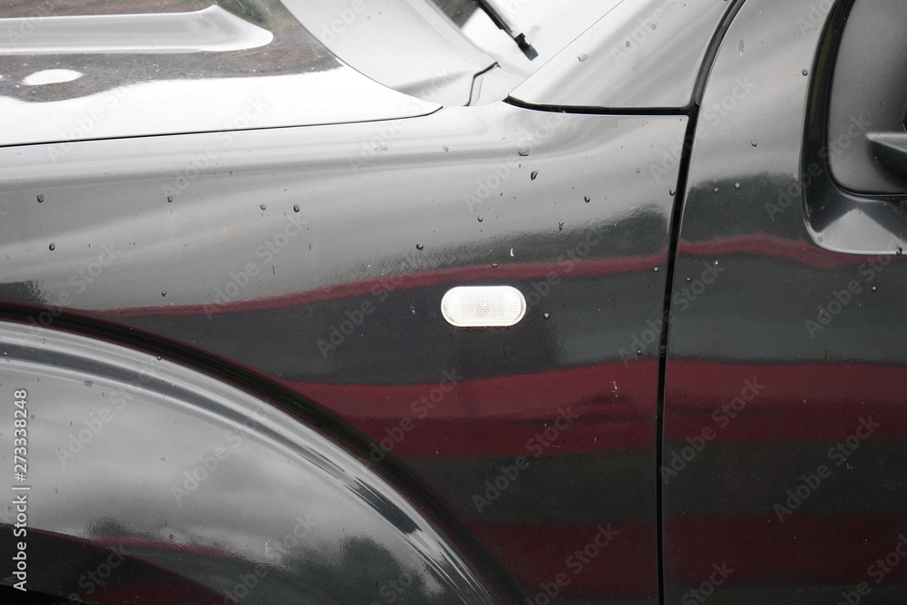 natural raindrops on panels of a car