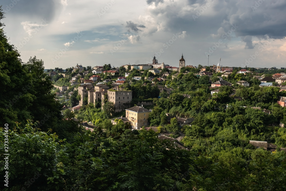 Panorama of the old city of Kamianets-Podilskyi, covered with greenery after rain. Ukraine.