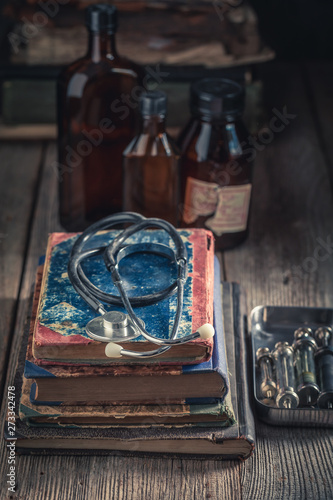 Antique stethoscope and books as medical education concept