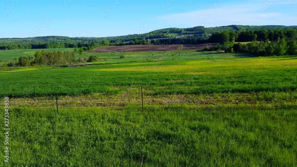 Overlooking Rural Fields in the Countryside in the Day. Beautiful Scenic Landscape Nature in the Country During Bright Daytime. Overlooking Rural Fields in the Countryside in the Day. Beautiful Scenic Landscape Nature in the Country During Bright Daytime.