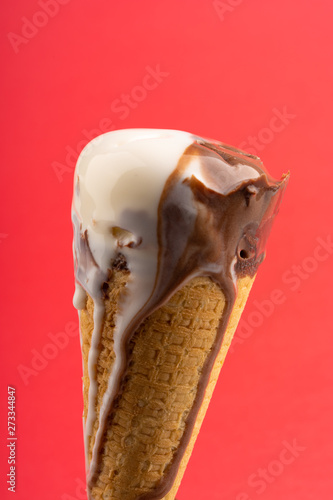 Fototapeta Naklejka Na Ścianę i Meble -  chocolate vanilla ice cream on red background