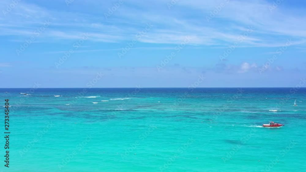 Aerial view from drone on caribbean sea coastline through coconut palm trees. Summer vacation. Tropical destination. Dominican Republic Aerial view from drone on caribbean sea coastline through coconut palm trees. Summer vacation. Tropical destination. Dominican Republic