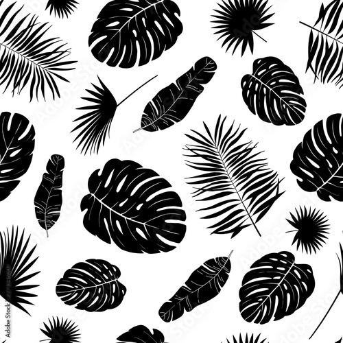 Tropical leaves seamless pattern. Exotic palm leaf silhouette. Vector illustration.