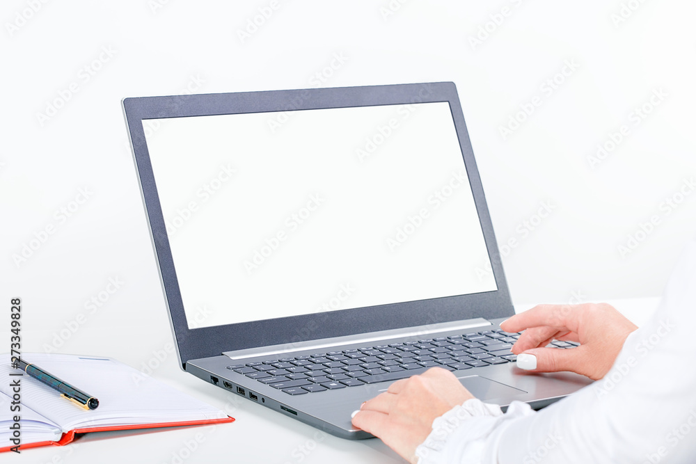 Businesswoman working on laptop, female hands typing on keyboard. Woman typing email on laptop computer while sitting at home. Businesswoman working on laptop, female hands typing on keyboard. Woman typing email on laptop computer while sitting at home.