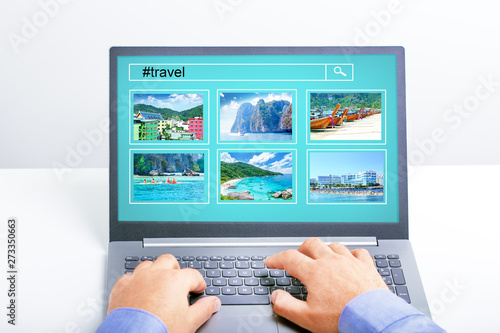 Man planning vacation trip and searching information or booking an hotel on a laptop.