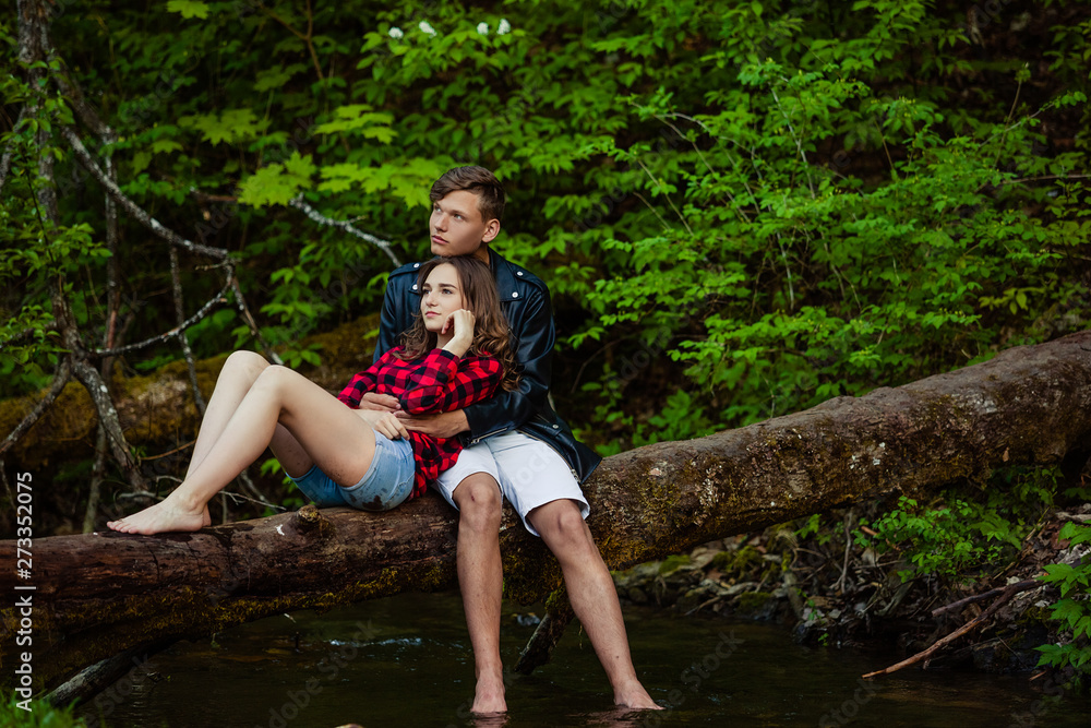 Beautiful couple walks in the woods