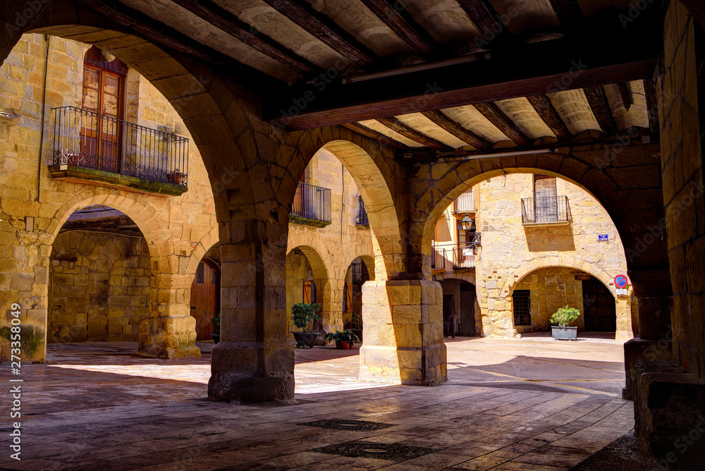 Arches in a medieval square in Horta de Sant Joan