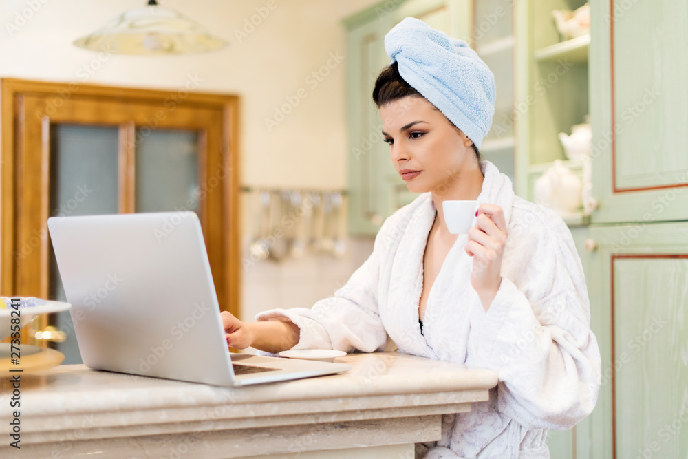 Woman drinking coffee and woking at home in the morning Woman drinking coffee and woking at home in the morning