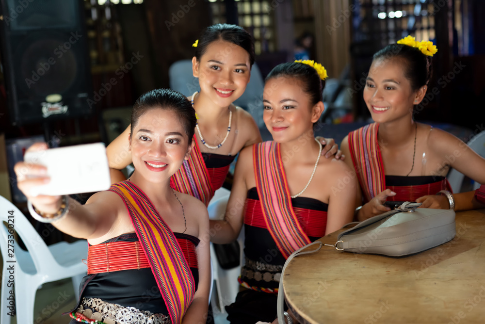 Φωτογραφία Group portrait of Kadazan Dusun young girls in traditional attire taking selfie with smart phone during state level Harvest Festival in KDCA, Kota Kinabalu, Sabah Malaysia