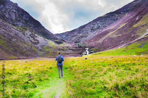 Scottish Highlands. Tourist walking to Falls of Unich. Glen Lee, Angus, Scotland, UK.
