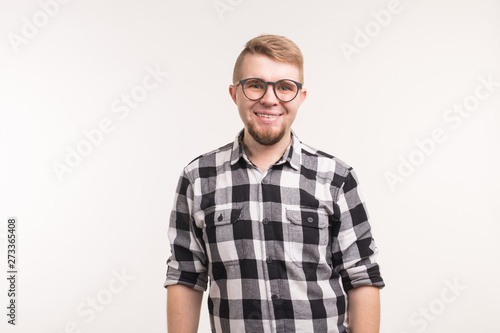 People, emotions and education concept - Portrait of smiling student man in shirt over white background © satura_