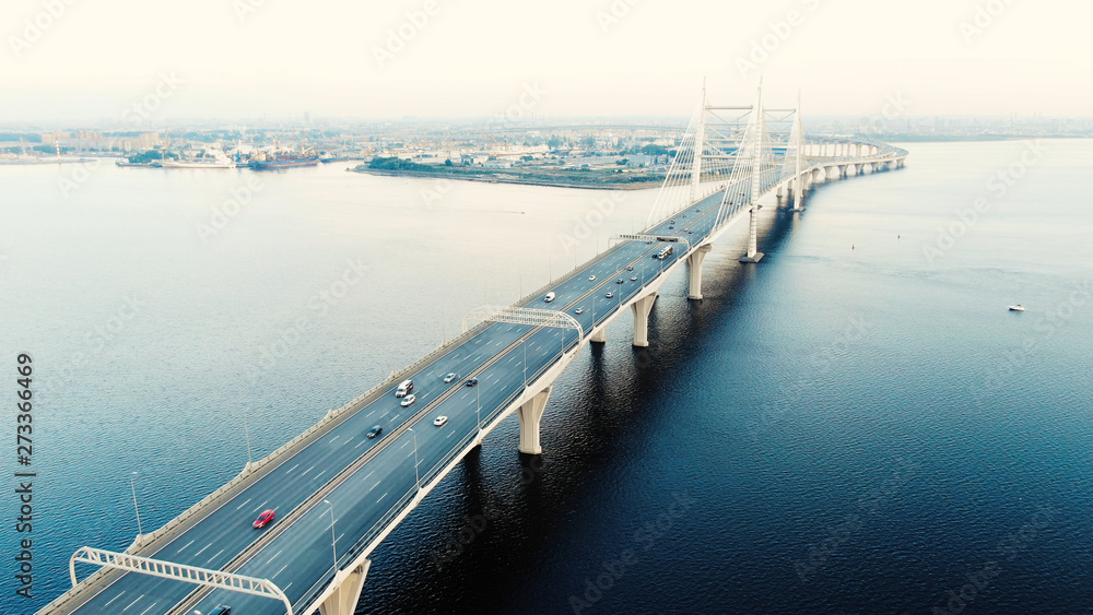 cable-stayed bridge with high pylons and speeding cars
