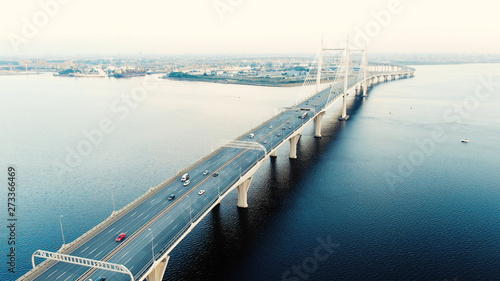 cable-stayed bridge with high pylons and speeding cars