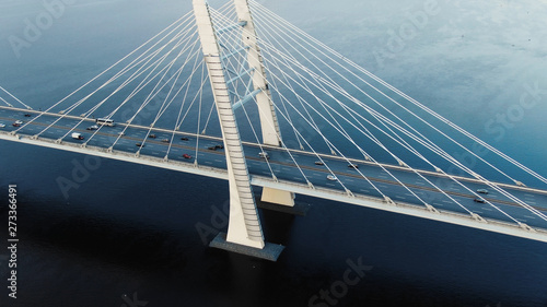 flycam shows modern cable-stayed bridge with pylons and cars photo