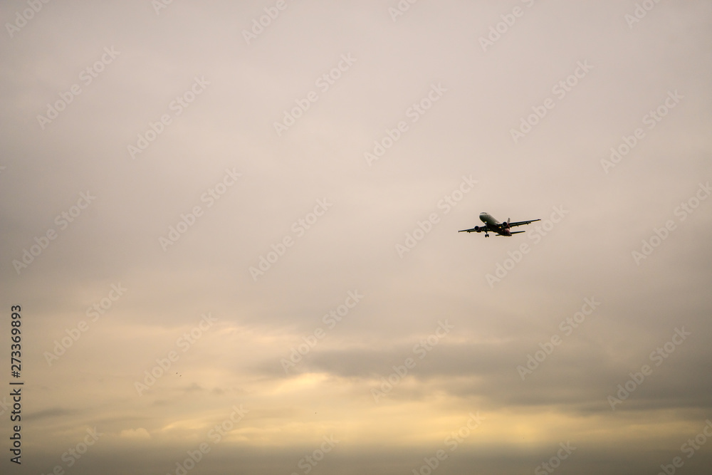 Aircraft on a background of cloudy sky. Landing a liner close-up. Spring. Day. Aircraft on a background of cloudy sky. Landing a liner close-up. Spring. Day.