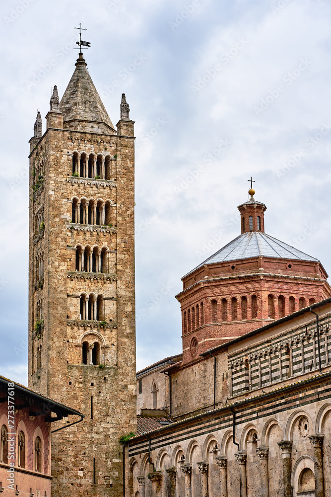 A historic church with a bell tower in the city of Massa Maritima in Tuscany...