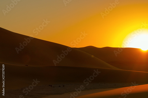 Sunset over the sand dunes in the Namib desert.