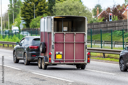 Slika na platnu empty horse carrier trailer box on uk motorway in fast motion