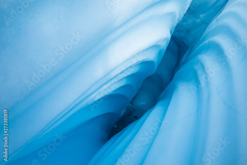 Narrow canyon cut through glacier ice by melting water. Matanuska Glacier in the Chugach Mountains of south central Alaska. photo