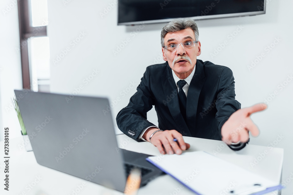 Older boss work with laptop with cheerful emotions.. Older boss work with laptop with cheerful emotions..