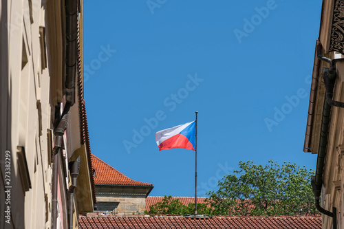 The czech flag waving on the roof