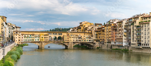 View of Arno River and medieval stone bridge Ponte Vecchio from the Ponte Santa Trinita in Florence, Tuscany, Italy © mckornik