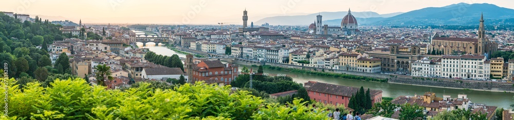 Long panoramic view of Florence from Piazzale Michelangelo.  Cityscape panorama with the Arno river, basilica, cathedral, Palazzo Vecchio