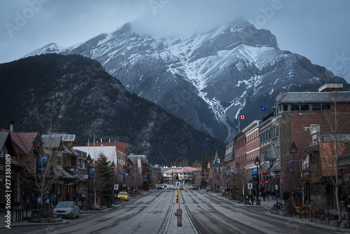 town of banff alberta with a giant mountain in the background of the village. located in alberta, Canada